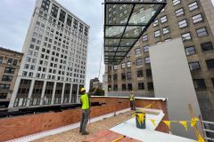 Installing glass roof on restaurant patio