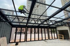 Installing glass roof on restaurant patio